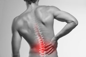 Chiropractor providing an adjustment to a patient with scoliosis to help correct spinal curvature.