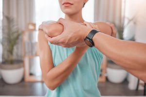 Chiropractor performing joint adjustments to provide arthritis relief and natural pain management.