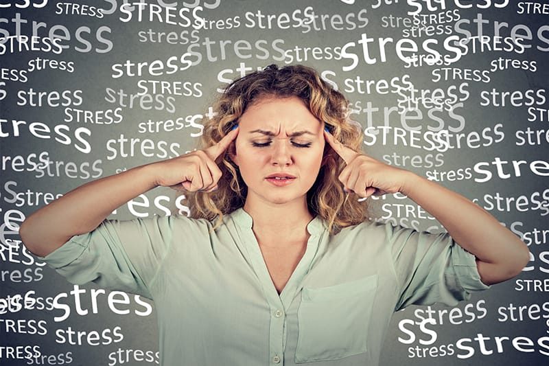 Chiropractor providing an adjustment to a patient for stress management.