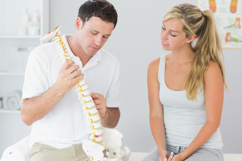Chiropractor performing preventative spinal check