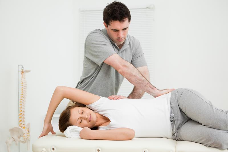 Gonstead chiropractor adjusting patient in San Diego clinic