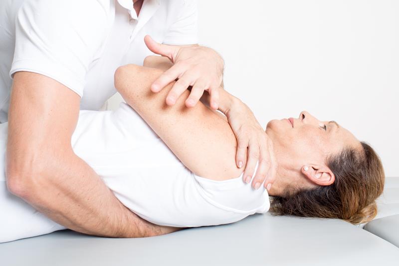 Gonstead chiropractor adjusting patient’s spine in Kearny Mesa office