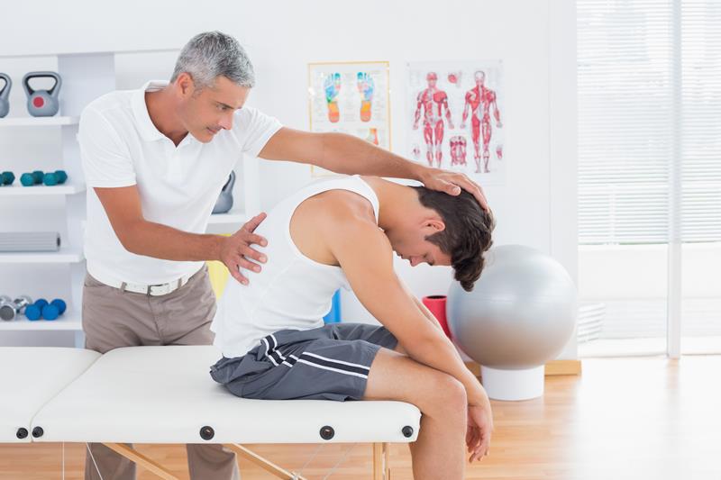 Patient getting routine adjustment after corrective care