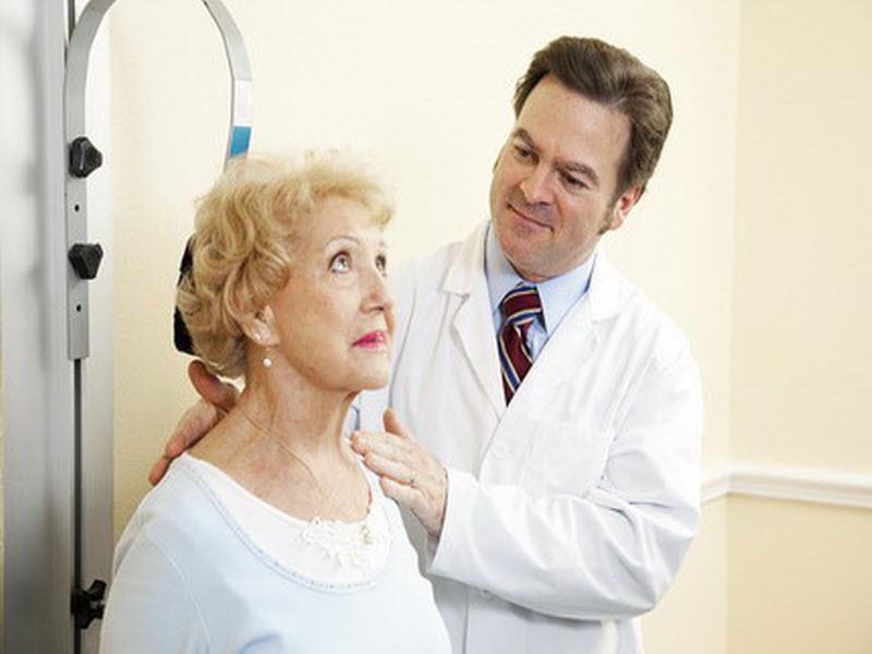Senior patient receiving gentle spinal care from chiropractor