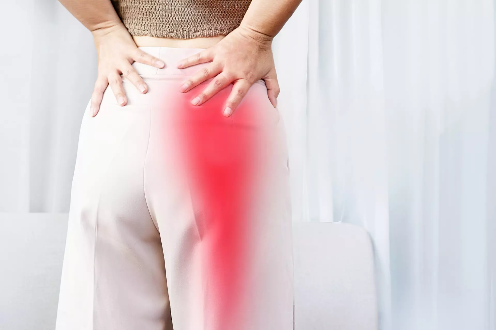 Patient receiving lumbar adjustment targeting sciatic nerve relief