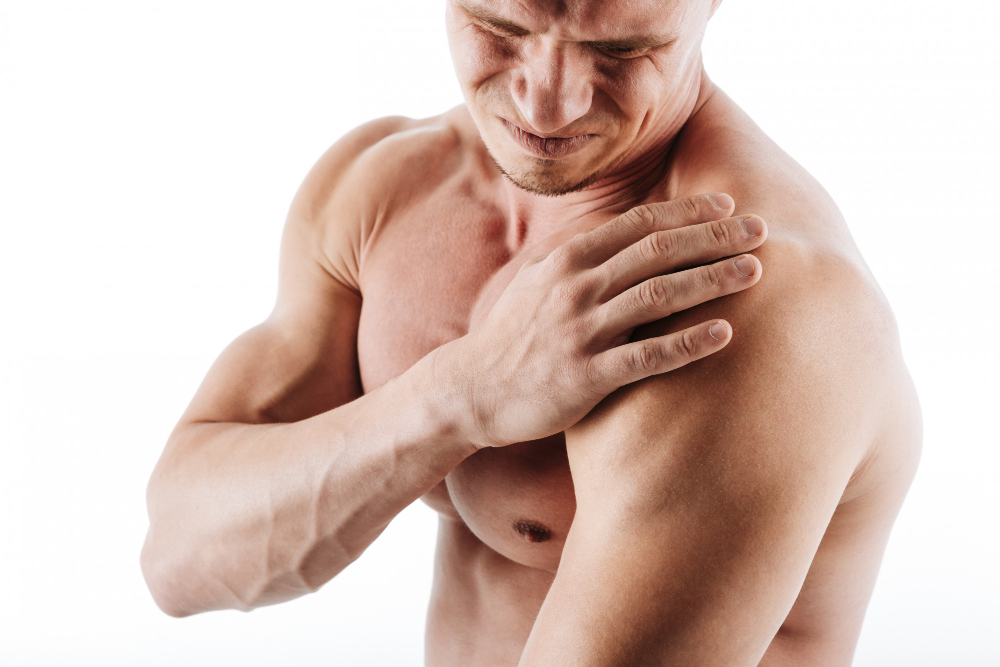 Athlete holding injured shoulder