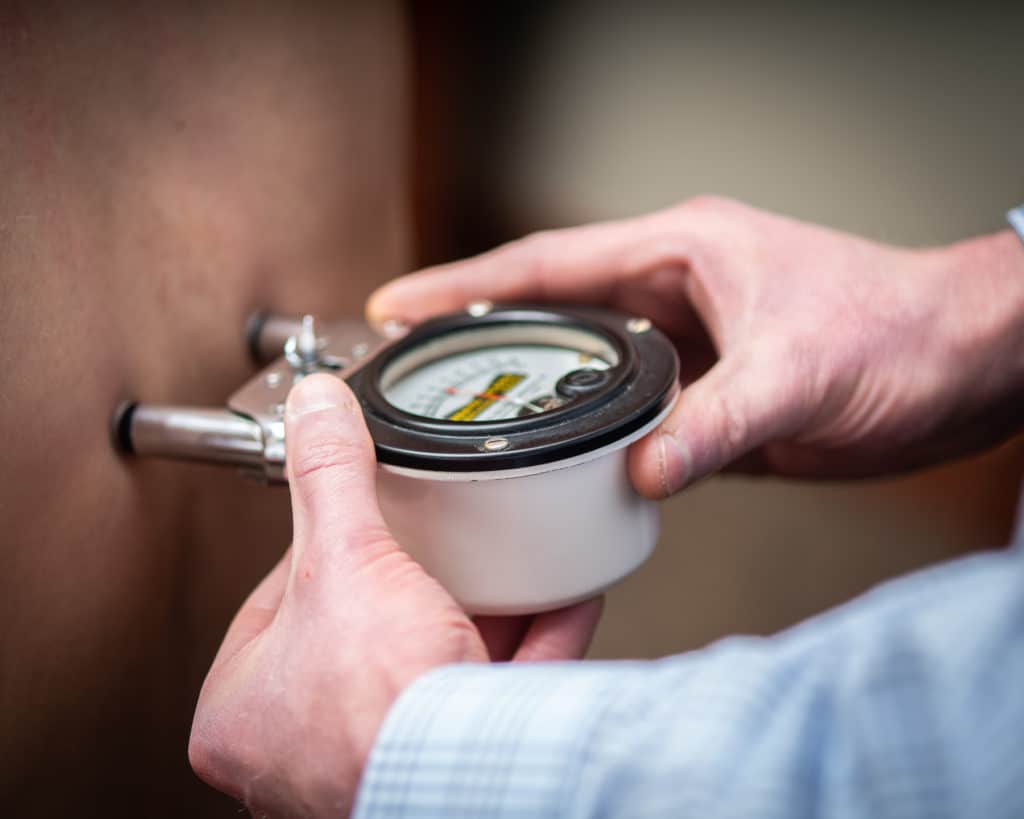 Gonstead chiropractor using nervoscope