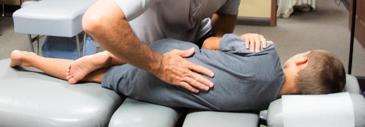 Kid receiving chiropractic care