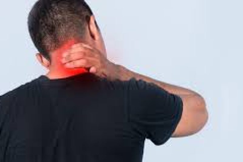 Person holding neck in pain
