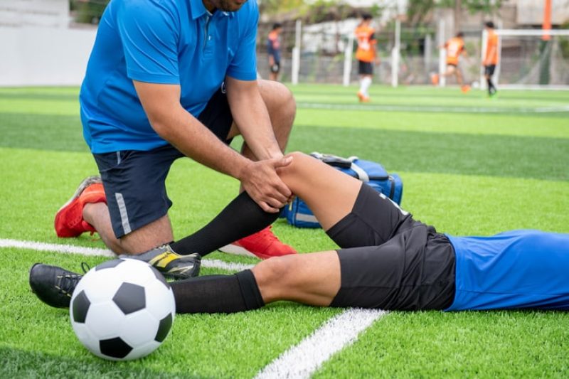 North County San Diego athlete experiencing lower back pain during summer training