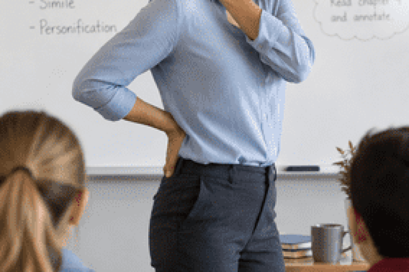 San Diego teacher experiencing neck and back pain from classroom work